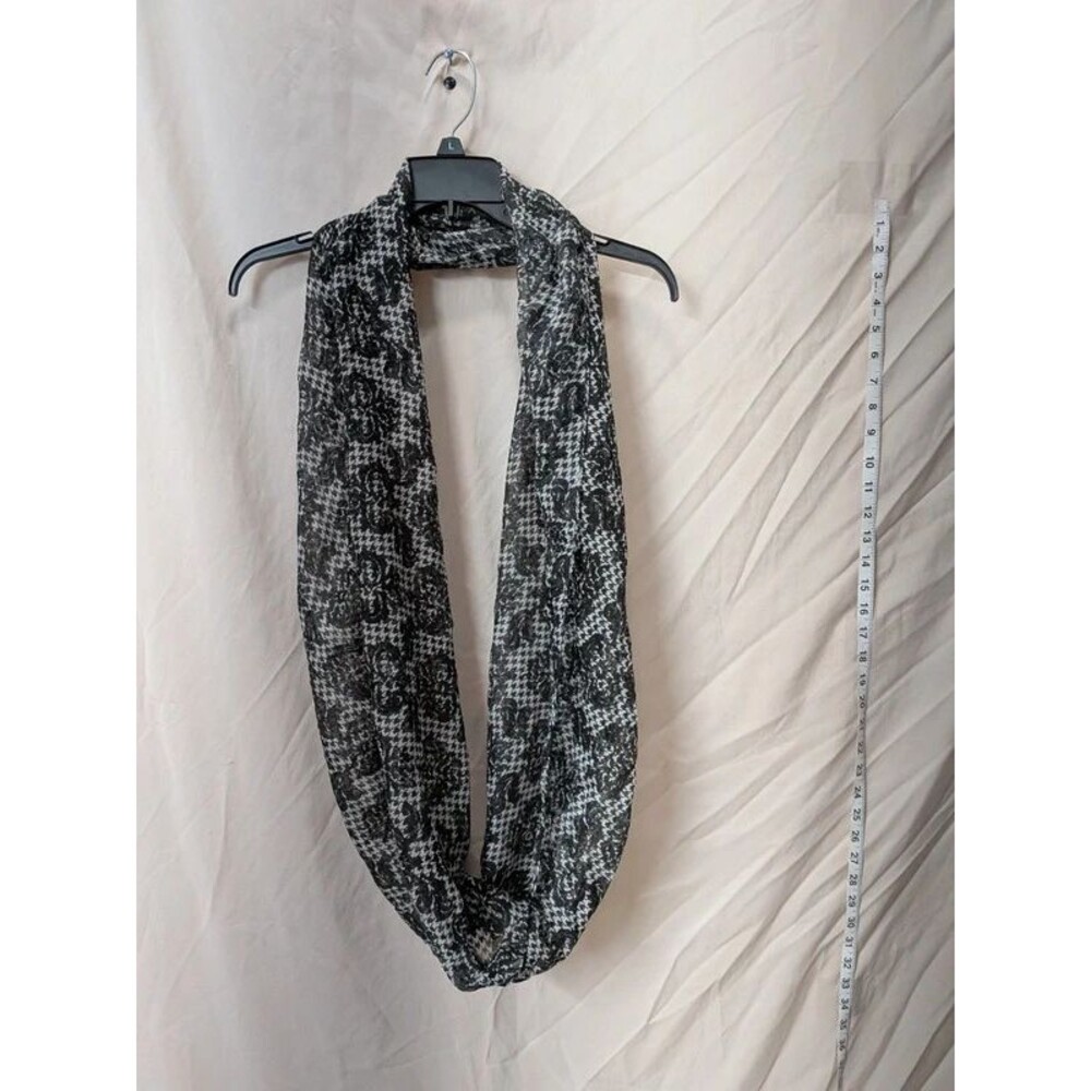 sheer black and white patterned infinity scarf with a continuous loop design
